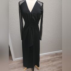 Dkny, Donna Karan New York, Long Black Evening Gown/Dress Size 6. V-Neck, Low Cut With Pretty Front Cinching At The Waist And A Front Draped Ruffle With A Hidden, Overlap Opening In The Middle Of The Drrss. Sheer, Long Sleeves. Bodice Is Lined, Skirt Part Is Not. Stretchy Fabric. Very Comfortable And Flattering Dress! New With Tags. 29" Waist. 59 1/2" Long. Sleeves 25" Long. Black Evening Dress With Surplice Neckline, Black Surplice Neckline Evening Dress, Black Surplice Neckline Dress For Evening, V-neck Maxi Dress With Sheer Sleeves For Party, Elegant Maxi Dress With Sheer Sleeves For Date Night, Black Maxi Dress With Surplice Neckline For Evening, Black Fitted Maxi Dress With Surplice Neckline, Black V-neck Dress With Sheer Sleeves, Long Black Evening Dress