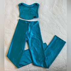 Dba Bojeangles Skin Ease Full Set Top And High Waisted Pants/Leggings Shiny Spandex/Nylon/Lycra Material In A Bright Aqua Color. These Are Original Vintage 70s And In Excellent Condition! Skin Tight And Thick Material! Very Slight Stains On Left Pant Leg (Pictured) That Can Likely Be Cleaned And Removed. Legs Are Serged And Can Easily Be Altered To Fit Any Height. Perfect Disco Babe Attire. Price Is For The Set. Will Not Sell Separately. Very Rare Matching Set Size: 1 - 5/6 Fits Extra Small - Sm 1970s Disco, Lycra Material, Pants And Top, Aqua Color, Small Tops, High Waisted Pants, Bell Bottoms, Full Set, Very Rare