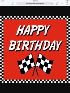 a happy birthday sign with two checkered flags