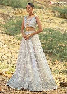 Buy Classy White Choli Bridal Lehenga Pakistani, a royal masterpiece to wear at a wedding. The perfectly stitched Bridal Lehenga Dress is available Online. Elegant Designer Tilla Sharara, Elegant Lehenga With Intricate Embroidery For Ceremony, Elegant Ceremony Lehenga With Intricate Embroidery, Elegant Ceremonial Lehenga With Traditional Drape, Elegant Traditional Drape Lehenga For Ceremony, Elegant Lehenga With Dupatta For Ceremony, Elegant Choli With Intricate Embroidery For Ceremonies, Elegant Saree Wedding Dress With Dupatta, Bollywood Choli With Sheer Dupatta For Ceremonies