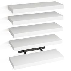 three white shelves are stacked on top of each other