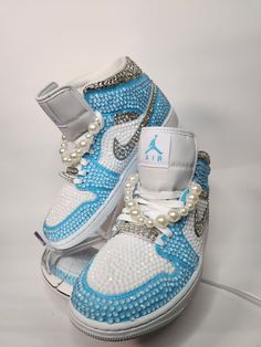 Step up your sneaker game with some fully blinged Jordan 1 mids. These shoes are a great addition for prom, a birthday, a wedding, a night on the town, or your  next event! These shoes can be customized to the colors of your choosing. Not looking for Jordan 1's? Message me with your shoe choice. I'd love to create the custom shoe of your dreams.  Please note that the shoe charms ARE NOT included in this listing. You can purchase them as a bonus add on by selecting the "extras listing" on my shop Items To Rhinestone, Blinged Out Shoes, Bedazzled Jordans, Customized Nikes, Blinged Shoes, Sneaker Ball Outfit Ideas, Bedazzled Shoes Diy, Must Have Shoes, Cute Jordans