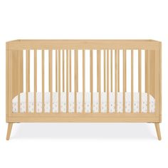 a wooden crib with white sheets on the bottom and side rails, in front of a