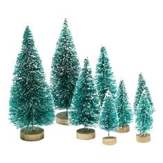 small green trees are lined up in the middle of a white background with gold bases