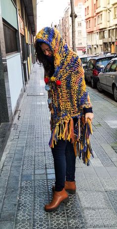 "Welcome! This beautiful sweater poncho is made of high quality blend wool fabric It's soft, lightweight warm and cozy with cool design! Its really amazing and is in very good condition! The measurements ( approximately ): width: 33.07\"= 84 cm Height : 44.48\"= 113 cm Thanks for stopping by!!IMPORTANT: Due to the delicate situation We're all going through, and in order to keep the safety of courier workers too, all orders will be dispatched when alert sanitary finished. You can purchased or res Bohemian Poncho With Scarf For Winter, Bohemian Knitted Cape For Winter, Bohemian Knitted Winter Cape, Casual Winter Poncho With Tassels, Bohemian Poncho For Cold Weather, Multicolor Bohemian Wool Poncho, Winter Multicolor Poncho With Tassels, Multicolor Poncho Shawl For Winter, Handmade Shawl Cape For Winter