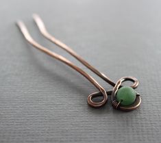 "This Celtic knot hair fork pin hand forged with 12 gauge solid copper wire and embellished with frosted green aventurine stone (8mm in diameter) and it was tumbled, oxidized and hand polished for more strength and depth. The shown pin is 4 1/2\"(11.4cm) long in total. The pin head is 1\" (2.5cm) long. PLEASE NOTE: You may need to use some additional bobby pins for you bun for better hold and add the hair pin as a decorative jewel to your hair. Length menu corresponds to the total pin length. AT Celtic Knot Hair, Celtic Hair, Pin Head, Knot Hair, Handmade Hairpin, Green Aventurine Stone, Pin Hair, Aventurine Stone, Hair Fork