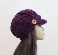 This is made to order. It is crocheted with chunky medium to dark purple acrylic yarn. Buttons will vary depending on availability. Hand wash is recommended. Adjustable Purple Yarn Crochet Hat, Adjustable Purple Crochet Yarn Hat, Adjustable Hand Knitted Purple Crochet Hat, Adjustable Hand-knitted Purple Crochet Hat, Adjustable Hand-knitted Purple Hat, Purple Hand Knitted Adjustable Hat, Adjustable Purple Crochet Hat, Purple Adjustable Hand Knitted Hat, Adjustable Purple Hand Knitted Crochet Hat