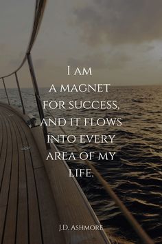 a boat in the ocean with a quote from j d asymore on it that reads, i am a magnet for success, and it flows into every area of my life