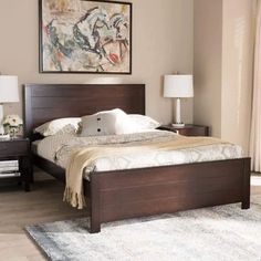 a bedroom with a bed and two nightstands in front of a painting on the wall