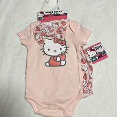 Brand New Hello Kitty Baby Girl Outfit Set Size 3-6 Months Color Salmon Pink 3 Pc Set Onesie, Shorts And Bow Headband Brand New Tags Attached Cute Pink Onesie With Cartoon Print, Cute Pink Sets With Cartoon Print, Cute Pink Cartoon Print Sets, Cute Pink Onesie For Playtime, Cute Pink Short Sleeve Onesie, Pink Cartoon Print Sets For Playtime, Hello Kitty Baby Stuff, Cute Baby Clothes Newborn, Hello Kitty Baby Clothes