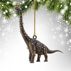 an ornament shaped like a dinosaur with lights on it's neck hanging from a christmas tree