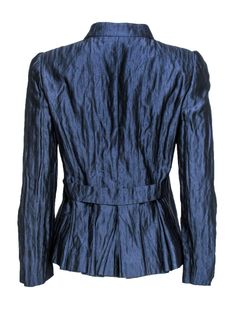 This dazzling piece is sure to turn some heads! Made with metallic silk, this Armani jacket is out of this world. Perfect for wearing with blouses and dress trousers, or over a bodycon dress -- however you wear this stunning piece is sure to add an Italian flair. Size 6 Made in Italy 88% Silk, 18% Metallic silk Front silver-toned button closures Slim fit design Upturned collar neckline Slightly padded shoulders Satin lining Waist 32" Bust 22" Total length 24" Armani Jacket, Armani Collezioni, Silk Jacket, Metallic Blue, Blue Silk, Dress Trousers, Out Of This World, This World, Silk Satin