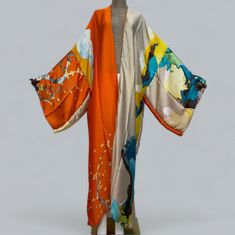 Our floral print kimono robe is designed to make you feel like you're on vacation every time you put it on.  The beautiful silk material provides comfort with a easy flow look for any occasion.  This Long robe is inspired to provides comfort and a fresh silhouette for a relaxed evening. It's elegant enough to wear as a bath robe yet stunning enough to wear over your favorite outfits.   Details: Size: ONESIZE FITS UP TO 3X Loose fitted Material: polyester  Occasion: perfect for the holiday, parti Long Silk Robe, Peach Blossom Flower, Tiger Dress, Bridal Dressing Gown, Silk Robe Long, Bridal Kimono, Gown Bridesmaid, Flora Print, Floral Print Kimono