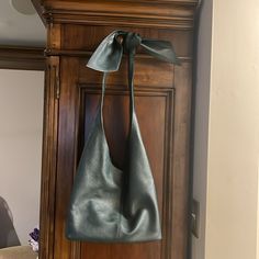 Purchased From Elie Tahari Website $448 Carried Two Times. No Signs Of Wear. Bag Is Slouchy And Unlined So Natural Creasing Is Expected. Pebbled Leather Slouchy Bag With Top Knotted Strap. Easily Unties For Adjusting The Length/ Can Go Across The Body Too. Detachable Leather Pouch Included. Unlined Interior With Magnetic Closure. Neutral Hunter Green Leather. Smoke Free Home. Will Provide Some Kind Of Dust Bag Pouch: 8” X 5.5”/ Bag Approximately 17” Width X 10” Height X 7” Depth Elegant Green Hobo Shoulder Bag, Elegant Green Satchel Hobo Bag, Elegant Green Top Handle Hobo Bag, Elegant Green Soft Leather Bag, Luxury Green Crossbody Hobo Bag, Green Leather Hobo Bag For Evening, Chic Hobo Bag With Removable Pouch For Gift, Chic Hobo Bag With Removable Pouch As Gift, Elegant Green Shoulder Bag With Handle Drop