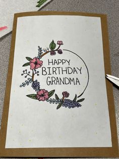 a handmade birthday card with flowers and the words happy birthday grandma written on it