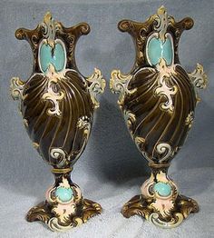 two ornate vases sitting on top of each other