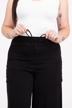 The Starting The Party Pants By Doe & Rae are a solid pair of wide leg pants. They feature a drawstring waist band, wide legs and pockets. 100% Rayon Inseam: Size M- 22'' Rise: Size M- 14'' True To Size S 0-6 M 6-10 L 10-14 XL/1XL 14-18 Stretch Wide Leg Cargo Pants With Drawstring, Summer Wide Leg Cargo Pants With Drawstring, Wide Leg Cargo Pants With Elastic Waistband, Spring Stretch Wide Leg Pants With Drawstring, Stretch Wide-leg Cargo Pants With Elastic Waistband, Drawstring Wide-leg Pants For Work, Wide-leg Pants With Drawstring, Stretch Wide Leg Bottoms With Drawstring, Spring Wide Leg Pull-on Cargo Pants