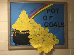 a pot of golds is on display in front of a poster