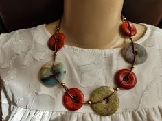 Add a touch of natural elegance to your ensemble with our Bohemian Agate Stone Necklace.  This necklace exudes a rustic charm. It is handcrafted with a series of polished agate stones, each featuring unique patterns and a palette of earthy tones.  Strung securely on a supple leather cord, it's designed for comfort and durability.   Perfect for those who adore statement jewelry with a natural flair. The Necklace fastens with a magnetic clasp Length is Adjustable Southwestern Round Necklace, Rustic Adjustable Necklace With Natural Stones, Rustic Adjustable Jewelry With Natural Stones, Handmade Round Earthy Necklaces, Handmade Southwestern Style Jewelry, Handmade Southwestern Style Everyday Jewelry, Handmade Earthy Round Necklaces, Handmade Round Earthy Necklace, Everyday Rustic Jewelry With Round Beads