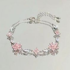 Description: Material: alloy Size:onesize Color:as picture 1. A bow symbolizes love, sweetness, and romance, while also conveying a feminine softness and elegance. 2. This bracelet features a slender chain with a cherry blossom shaped pendant embedded in the middle, which not only serves as decoration but also enhances the overall visual appeal of the bracelet. 3. Suitable for daily casual attire, it can also add a touch of warmth and romance in special occasions such as dates, parties, celebrat Pink Hand Jewelry, Silver Earrings Design, Girly Jewelry Silver, Silver Flower Jewelry, Cute Gifts For Bestie, Girly Things To Buy, Egirl Jewelry, Cute Jewelry Bracelets, Gifts For Friends Birthday