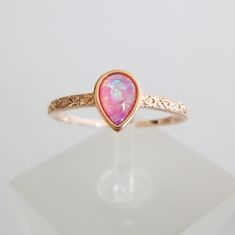 This Is A 7mmx5mm Teardrop Simulated Pink Opal Cabochon Set On Sterling Silver With 18k Rose Gold Over It. The Colors Inside Are Gorgeous And The Extra Detail On The Metal Work Gives It A More Upscale Look. Very Delicate And Elegant, See Pictures For Details. Spiritual Rocks, Ring Board, Opal Engagement Rings, Pink Opal Ring, Run The Jewels, Pretty Ear Piercings, Ring Inspo, Ph Level, Engagement Rings Opal