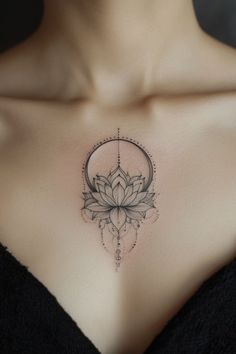 a woman's chest with a lotus tattoo on the top and bottom part of her breast