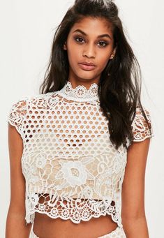 Look lavish in lace. This premium top features a fresh white hue, full lace overlay, high neck and button detail at the back. It's a serious weekend show-stopper! Mesh Tops, Tops Blouse, Ladies Tops, Bride Poses, Cami Crop Top, Tops Online, Short Sleeve Cropped Top, Online Tops, New Tops