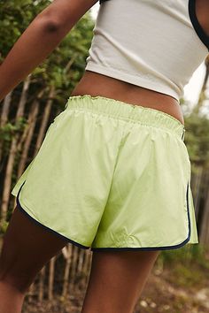 So comfy and active-ready, these billowy shorts feature a high-rise fit and smocked elastic waistband with pleated detailing at the sides. **Fit:** Relaxed fit, shorty-length, pull-on style **Features:** Lightweight and breathable fabrication, smocked elastic waistband, contrast seams, pleated side detail for added dimension **Why We | Easy Tiger Shorts by FP Movement at Free People, Keylime Combo, S Athleisure Shorts For Spring Vacation, Relaxed Fit Athletic Shorts With Elastic Waistband For Spring, Sporty Bottoms With Elastic Waistband For Summer, Sporty Summer Bottoms With Elastic Waistband, Spring Athletic Shorts With Elastic Waistband, Athleisure Shorts With Elastic Waistband For Summer, Sporty Spring Shorts With Short Inseam, Sporty Athletic Shorts For Spring Vacation, Sporty Shorts For Spring Vacation