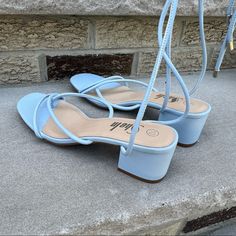 Fancy Up Your Look With This Gorgeous Dress Sandal. The Ankle Tie Up Gives A Chic Update To This Casual Thong Strap Sandal That Is Lifted With A Dainty Heel. Size: 10 M Block Heel - 2.5” Color: Light / Sky Blue Brand New. Never Worn. No Dustbag. No Box. Synthetic Upper Ankle Tie Closure Square Open Toe Synthetic Lining Synthetic Sole Imported High Heel Light Blue Sandals For Summer, Light Blue High Heel Sandals For Summer, Low Heel Lace-up Sandals For Beach In Spring, Low Heel Lace-up Sandals For Spring Beach Outings, Spring Beach Lace-up Low Heel Sandals, Adjustable Light Blue Sandals For Spring, Casual Light Blue Summer Heels, Blue Summer Sandals With Ankle Strap, Blue Ankle Strap Sandals For Summer