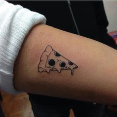 a person with a tattoo on their arm that has a slice of pizza on it