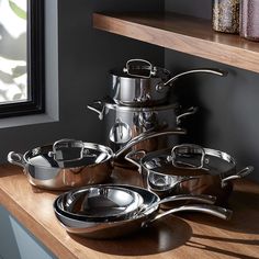 a stack of pots and pans on a counter