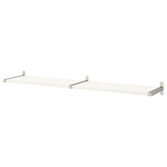 two white shelfs with metal brackets on each side and one in the middle, against a