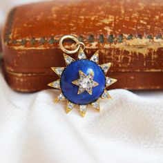 This is a very special piece that would be a great investment to any jewellery lovers collection. The star has been crafted from 15ct yellow gold and the central dome is carved natural blue Lapis gemstone. Set into the Lapis is a gold star motif set with antique rose cut diamonds. The sun rays/points on the outer perimeter of the Lapis have also been set with rose cut diamonds. Age: Victorian Diamond: Antiques rose cut diamonds Face Dimensions: 20.5mm x 20.5mm x 8mm Metal: 15ct Yellow Gold Tested As: 15ct Yellow Gold Weight: 3.0 grams Condition: Very Good (Layaway available on all items) Luxury Gold Starburst Jewelry, Luxury Starburst Gold Jewelry, Vintage Star-shaped Wedding Jewelry, Luxury Domed Jewelry For Gifts, Antique Yellow Gold Star Jewelry, Antique Gold Star-shaped Jewelry, Luxury Starburst Jewelry For Gifts, Luxury Starburst Jewelry Gift, Face Dimensions