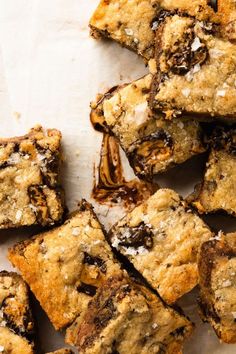 chocolate chip cookie bars are piled on top of each other