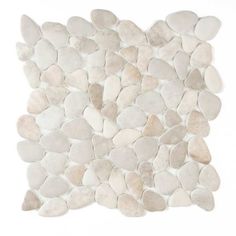 a white and beige rug with pebbles on it