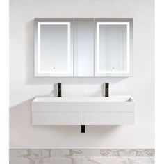 a bathroom sink with two mirrors above it