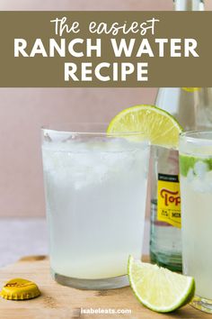 a bottle of lemonade next to a glass with ice and lime