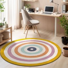 a room with a desk, chair and rug that has circles on the floor in different colors