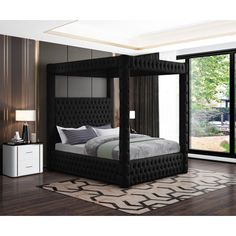 a bedroom with a black bed frame and white pillows on top of the bedspread