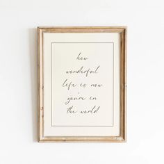 a framed print with the words how wonderful life is now you're in the world