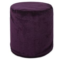 a large purple ottoman sitting on top of a white floor