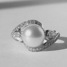 Elegant Diamond Pearl Ring For Promise, Elegant Diamond Pearl Promise Ring, Elegant Pearl Ring With Diamond Center Stone, Elegant Sterling Silver Diamond Ring, Elegant Pearl Ring With Round Cut Center Stone, Elegant Gemstone Ring, Elegant White Gold Pearl Ring With Diamond Accents, Elegant Platinum Rings, Elegant Pearl Ring With Diamond In Round Cut