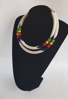 100% handcrafted using fine beads. The 2 strands are joined together to make one piece. Measurements; 19 inches for the long strand and 18 inches for the short one. **Buy multiple items and pay shipping for 1 item only.The rest ships free. More neckleces here; https://www.etsy.com/shop/TribalTess?ref=seller-platform-mcnav&section_id=21306083 Back to my shop; https://www.etsy.com/shop/TribalTess?ref=seller-platform-mcnav Traditional Handmade Double Strand Beaded Necklaces, Traditional Handmade Double Strand Beaded Necklace, White Double Strand Beaded Necklace With Colorful Beads, White Double Strand Necklace With Colorful Beads, White Double Strand Beaded Necklace, Handmade White Double Strand Beaded Necklaces, Handmade White Double Strand Beaded Necklace, African Wedding Jewelry, African Necklace