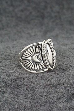 This finely crafted sterling silver ring was made by Navajo silversmith Derrick Gordon. The back is signed Derrick and stamped sterling.Size: 9.5Length: 5/8"Free shipping on all orders! We ship with USPS and always include tracking. All orders ship within a day of payment.Returns are accepted up to 30 days after you receive your order. Just send us a message. Our shop offers cash back or store credit. The item must be returned in new condition. Western Style Sterling Silver Rings In Silver, Handmade Silver Western Style Rings, Western Style Sterling Silver Rings, Handmade Western Silver Rings, Silver Bohemian Concho Rings, Bohemian Silver Concho Rings, Western Sterling Silver Concho Rings, Western Style Sterling Silver Concho Rings, Native American Jewelry