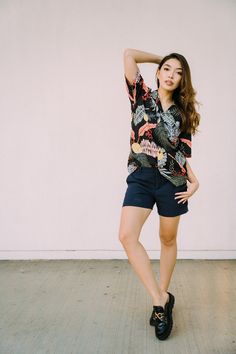 Reimagine the iconic Aloha Shirt for our chic gals with our Women's Petite Aloha Shirt. Giving you the sleek boyfriend fit with a relaxed silhouette, it's the ideal Hawaiian-inspired piece to add to your wardrobe. Offering versatility and style, choose how you wear your aloha shirt; button it up, leave it open, tuck it in, tie a knot, or turn it into a cropped shirt for a splash of fun in your outfit. This is your new go-to piece that radiates confidence, featuring actual coconut buttons with a matching left breast pocket. * 100% Rayon * Offering S-L. * Matching print on the left breast pocket. * Real coconut buttons. * Cut & sewn in Hawaii, USA. * Machine washable. More Made-in Hawaii Gift Ideas: https://www.etsy.com/shop/NinthIsle?ref=search_shop_redirect More Made in Hawaii Matching Fam Summer V-neck Hawaiian Shirt, Summer Hawaiian V-neck Top, V-neck Hawaiian Shirt For The Beach, V-neck Hawaiian Shirt For Beach, Hawaiian Beach V-neck Shirt, Summer Blouse With Camp Collar For Vacation, Summer Hawaiian Blouse With Tropical Print, Summer Hawaiian Tropical Print Blouse, Hawaiian Style Summer Blouse With Tropical Print