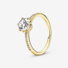 a yellow gold engagement ring with diamonds on the side