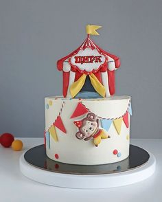 a birthday cake with a circus theme on it