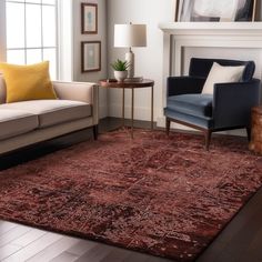 a living room filled with furniture and a fire place next to a window on top of a hard wood floor