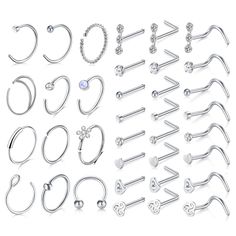 a bunch of different types of piercings on a white background, including nose rings