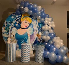 there are balloons and decorations on display in the room with princesses, snowflakes, and other items